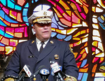Fire Commissioner Adam Thiel speaks at a press conference