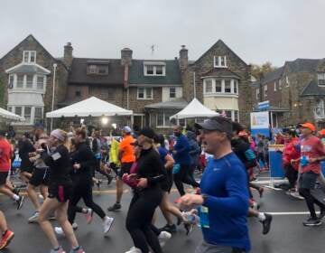 Runners take off at the start of at the start of the Broad Street Run. Participants had to provide proof of vaccination. (Mallory Falk, WHYY)