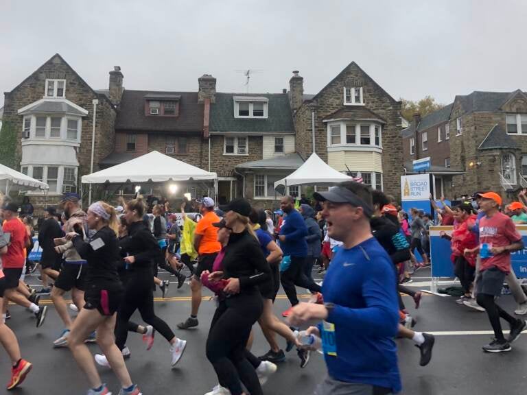 Runners take off at the start of at the start of the Broad Street Run. Participants had to provide proof of vaccination. (Mallory Falk, WHYY)