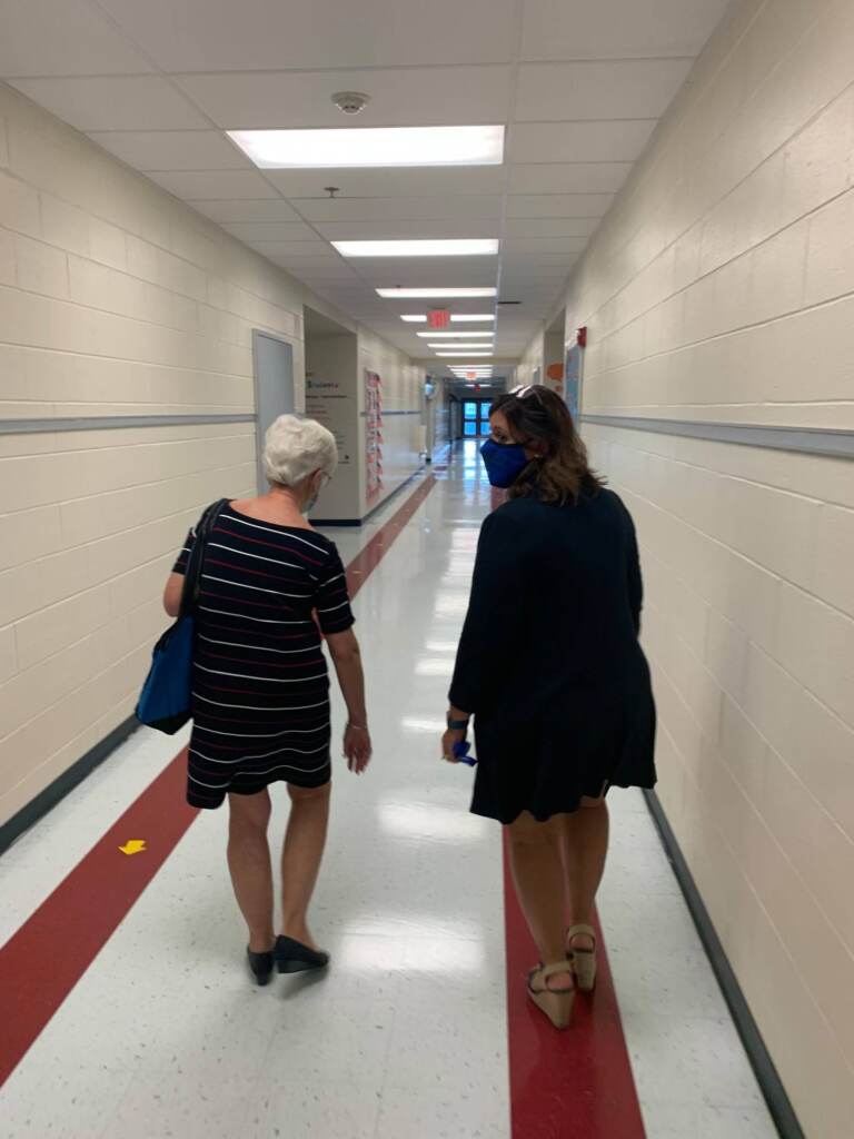 Susan Bunting's days of visiting schools as education secretary are nearing an end. Here she walks down one hallway with former Capital district Superintendent Sylvia Henderson