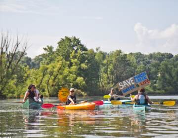 Protesters of Sunoco’s Mariner East Pipline kayaked to a clean-up site on Marsh Creek Lake in Chester County, Pa., where the DEP says 8,000 gallons of drilling mud migrated into the stream. (Kimberly Paynter / WHYY)