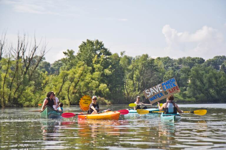 Protesters of Sunoco’s Mariner East Pipline kayaked to a clean-up site on Marsh Creek Lake in Chester County, Pa., where the DEP says 8,000 gallons of drilling mud migrated into the stream. (Kimberly Paynter / WHYY)