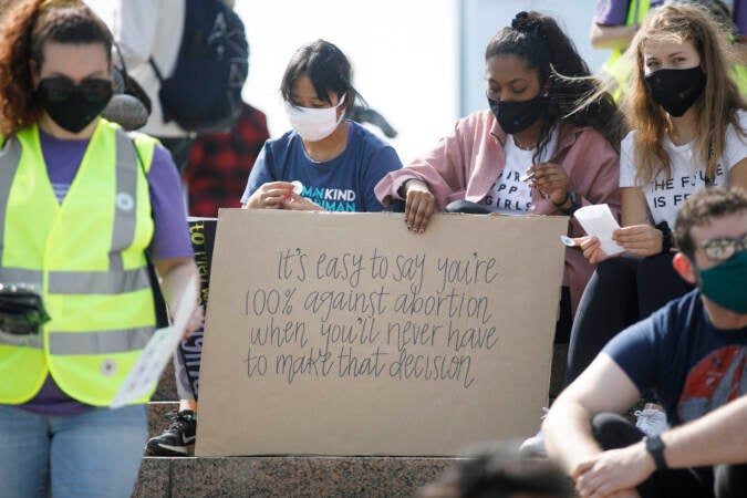 Marchers hold up signs outside Philadelphia Museum of arts as part of an abortion rights rally held in Philadelphia, PA on Saturday, Oct. 2, 2021. Hundreds gather in Philadelphia as part of 