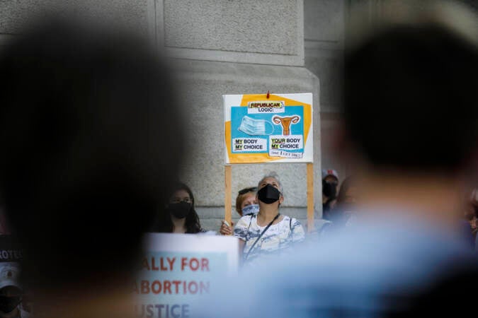 Marchers hold up signs outside Philadelphia City Hall as part of an abortion rights rally held in Philadelphia, PA on Saturday, Oct. 2, 2021. Hundreds gather in Philadelphia as part of 