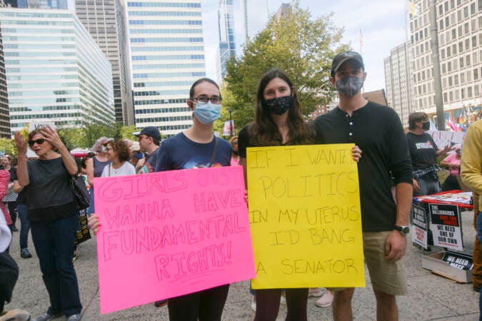 From left, McKensie Collins, Kelly Fogan and Austin O. from Philadelphia pose for a picture outside Philadelphia City Hall during an abortion rights rally held in Philadelphia, PA on Saturday, Oct. 2, 2021. Hundreds gathered in Philadelphia as part of the 