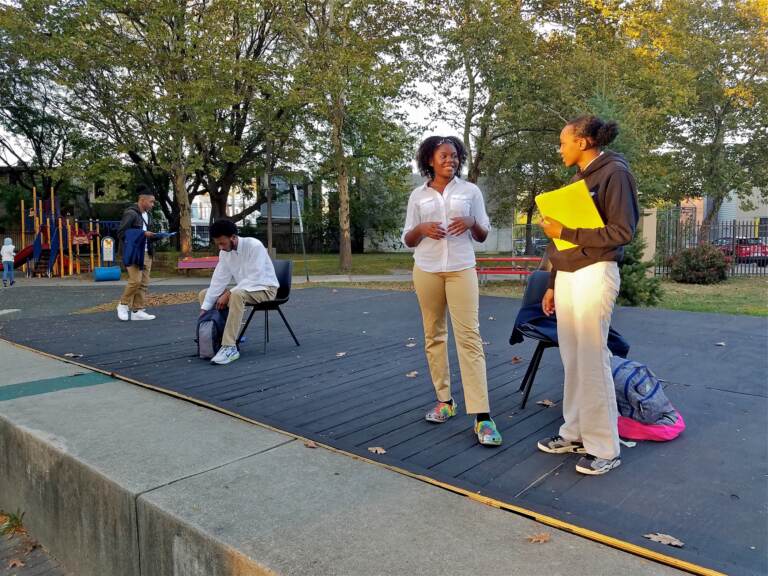 Cast members (from right) Azzari Myers, Eva Vanterpool, Carmi Jackson, and Jamall Phillips rehearse ''Town Hall: Resolution 50'' in Camden’s Northgate Park. The play about environmental racism in Camden will be performed this Saturday, in the park