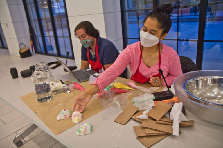 Ivonne Pinto-García with the Philadelphia Folklore Project teaches a Calavera (sugar skull) making workshop at the Free Library in Center City on October on October 26, 2021. (Kimberly Paynter/WHYY)