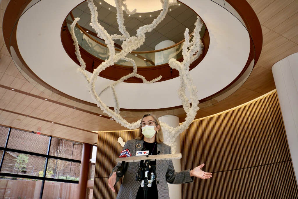 Hospital of the University of Pennsylvania CEO Regina Cunningham speaks in front of Maya Lin's sculpture in the atrium of Penn Medicine's new $1.6 billion facility.