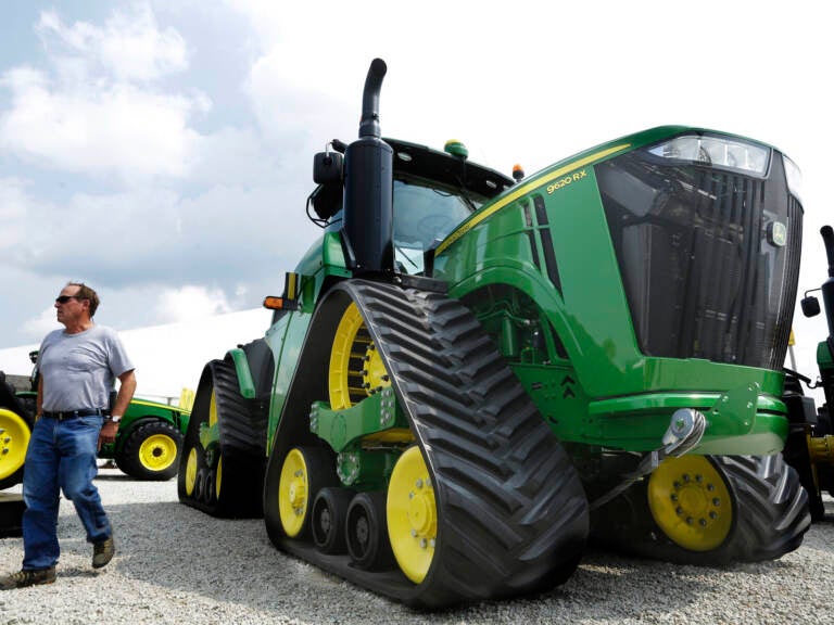 Douglas Johnson looks at John Deere equipment on display