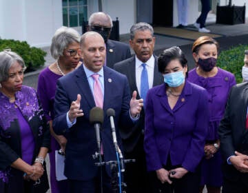 Rep. Hakeem Jeffries, standing with other House Democrats, talks to reporters