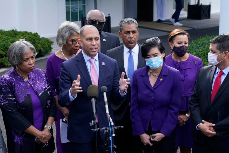 Rep. Hakeem Jeffries, standing with other House Democrats, talks to reporters