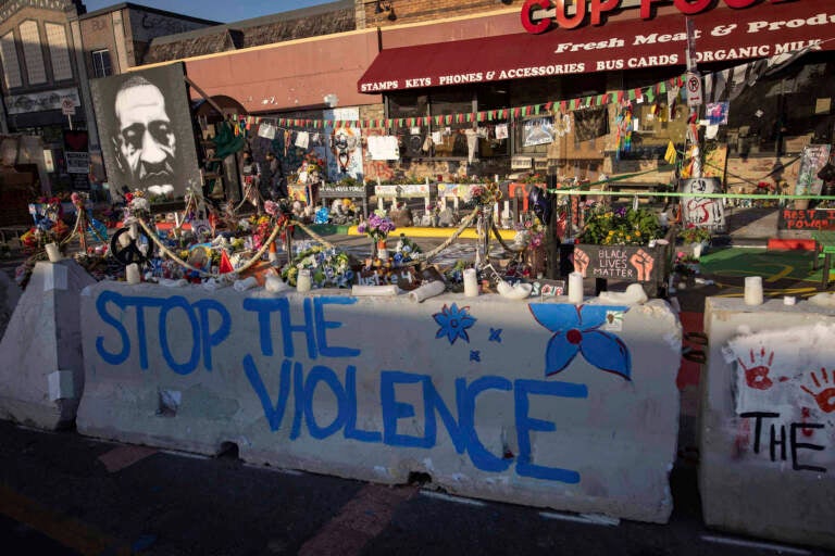 Jersey barriers placed by the city of Minneapolis surround memorials as community members gather in George Floyd Square to demand justice for Winston Boogie Smith Jr., on Monday, June 7, 2021. Smith was fatally shot by members of a U.S. Marshals task force. (AP Photo/Christian Monterrosa)