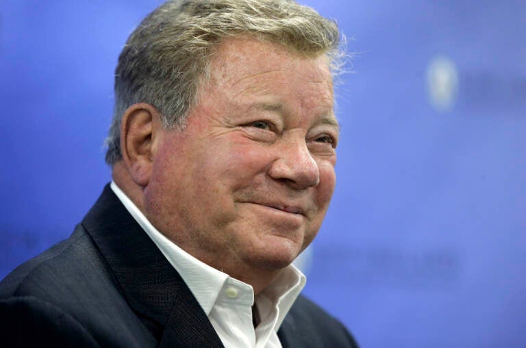 FILE - In this May 6, 2018 file photo, actor William Shatner takes questions from reporters after delivering the commencement address at New England Institute of Technology graduation ceremonies, in Providence, R.I.