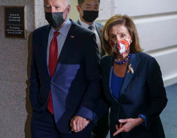 President Joe Biden and Speaker of the House Nancy Pelosi, D-Calif., talk in a basement hallway of the Capitol after meeting with House Democrats to rescue his his $3.5 trillion government overhaul and salvage a related public works bill, in Washington, Friday, Oct. 1, 2021