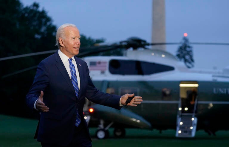 President Joe Biden talks with reporters after returning to the White House in Washington, Tuesday, Oct. 5, 2021, after a trip to Michigan to promote his infrastructure plan