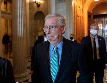 Senate Minority Leader Mitch McConnell of Ky., walks to a policy luncheon on Capitol Hill, Thursday, Oct. 7, 2021, in Washington