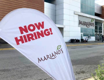 A sign in the parking lot of Mariano's grocery store advertises the availability of jobs Friday, Oct. 8, 2021, in Chicago.  One reason America’s employers are having trouble filling jobs was starkly illustrated in a report Tuesday, Oct. 12: Americans are quitting in droves.  (AP Photo/Charles Rex Arbogast)