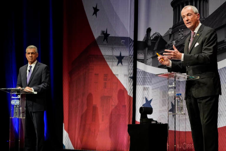 Incumbent Gov. Phil Murphy, D-N.J., right, speaks while Republican challenger Jack Ciattarelli listens during a gubernatorial debate at Rowan University's Pfleeger Concert Hall Tuesday, Oct. 12, 2021, in Glassboro, N.J.