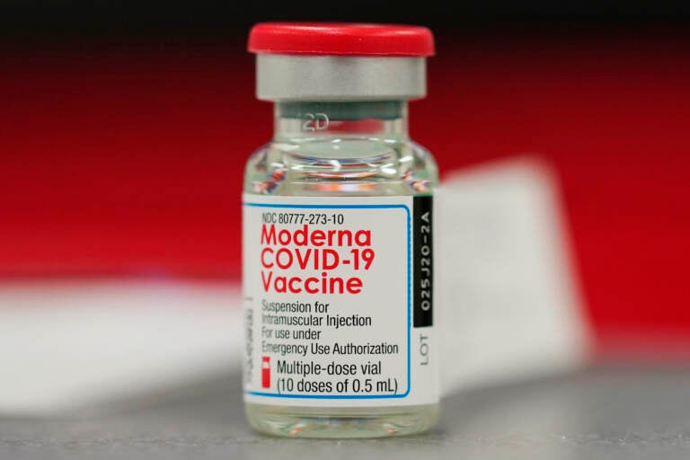 A vial of the COVID-19 vaccine from Moderna sits on a table top to be used in vaccinating employees in the first round of staff vaccinations at Rose Medical Center Wednesday, Dec. 23, 2020, in Denver