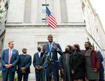 Bakari Sellers, center, attorney for the families of victims killed in the 2015 Mother Emanuel AME Church shooting, in S.C., speaks with reporters outside the Justice Department, in Washington, Thursday, Oct. 28, 2021