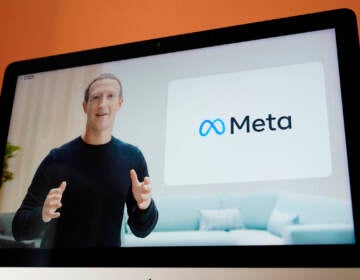 Seen on the screen of a device in Sausalito, Calif., Facebook CEO Mark Zuckerberg announces their new name, Meta, during a virtual event on Thursday, Oct. 28, 2021
