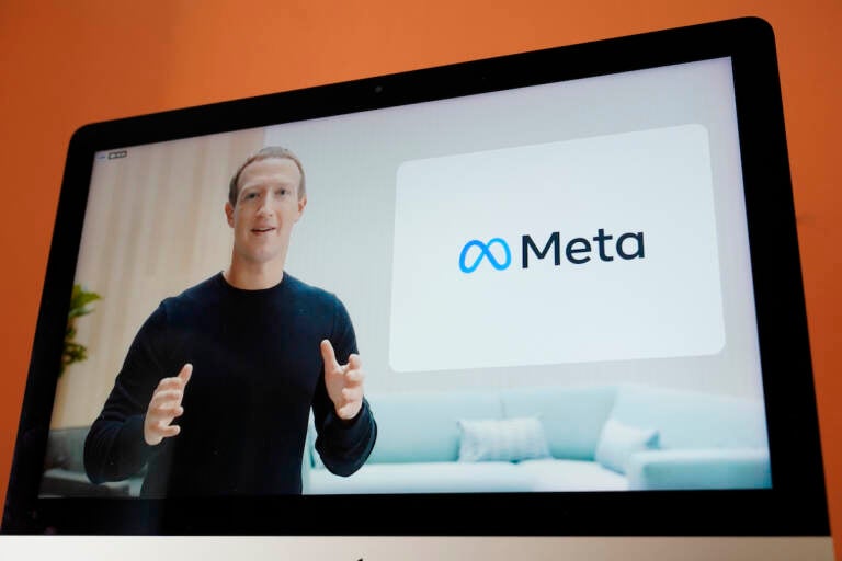 Seen on the screen of a device in Sausalito, Calif., Facebook CEO Mark Zuckerberg announces their new name, Meta, during a virtual event on Thursday, Oct. 28, 2021