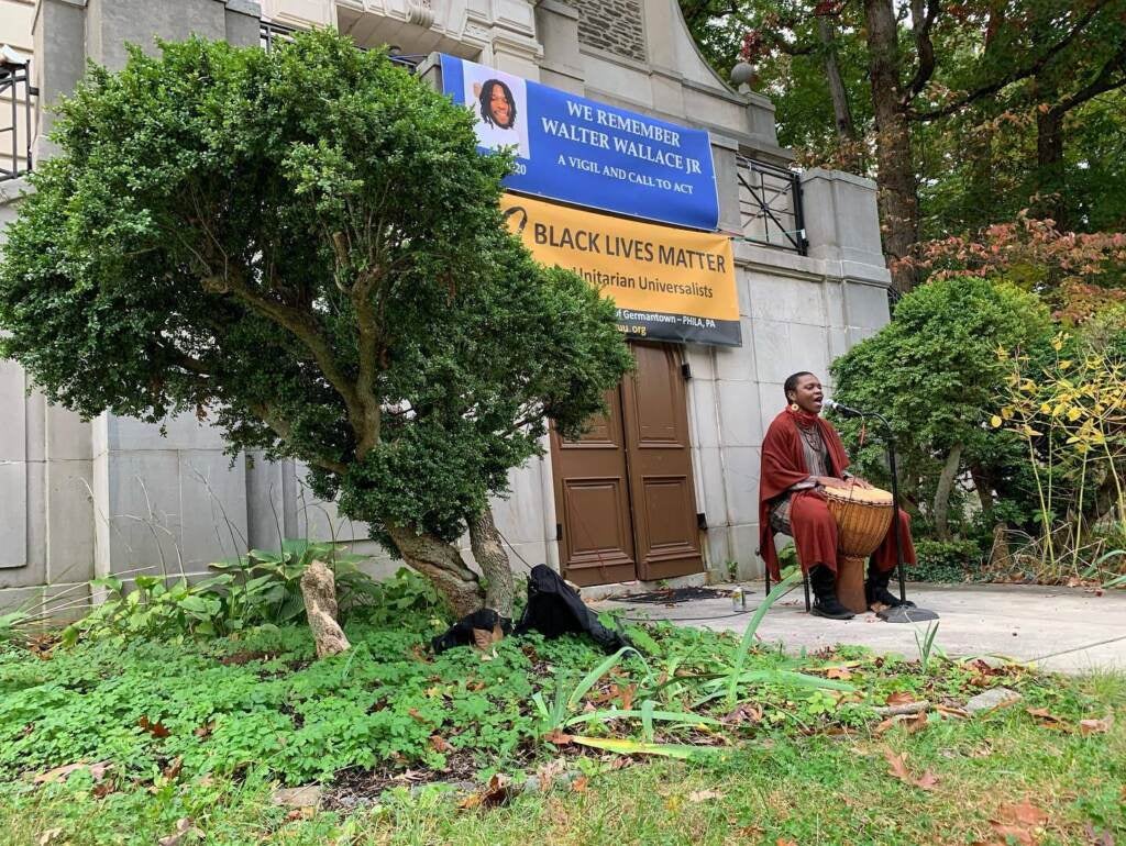 West African singer, Mariama O'Brien, performs at a vigil for Walter Wallace Jr. at the Germantown Unitarian Society in Philadelphia on Oct. 27, 2021