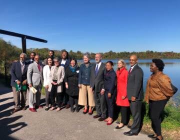 Members of the Pennsylvania Black Caucus, environmental advocates, and Gov. Tom Wolf stand for a photo at The Discovery Center in Fairmount Park, Philadelphia. (Ericka Conant/WHYY)