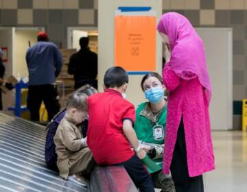 Children and adult from Afghanistan at PHL Airport (David Rosenblum/ BillyPenn)
