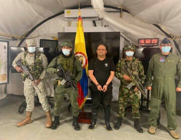 In this photo released by the Colombian presidential press office, one of the country’s most wanted drug traffickers, Dairo Antonio Usuga, alias “Otoniel,” leader of the violent Clan del Golfo cartel, is presented to the media at a military base in Necocli, Colombia, Saturday, Oct. 23, 2021.  (Colombian presidential press office via AP)