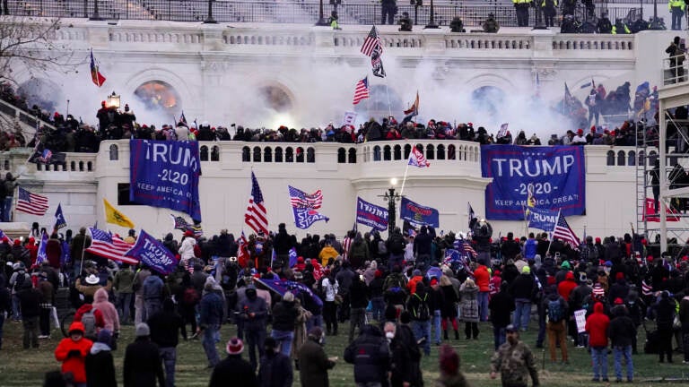 Protesters storm the Capitol on Jan. 6. (John Minchillo/AP)