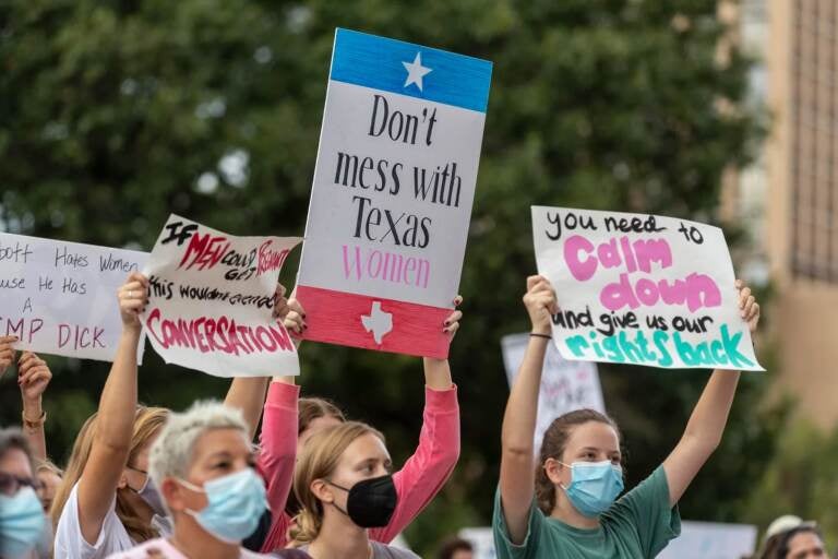 People take part in the Women's March ATX rally, Saturday, Oct., 2, 2021 in at the Texas State Capitol in Austin, Texas