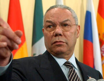 U.S. Secretary of State Colin Powell points to a reporter during a news conference