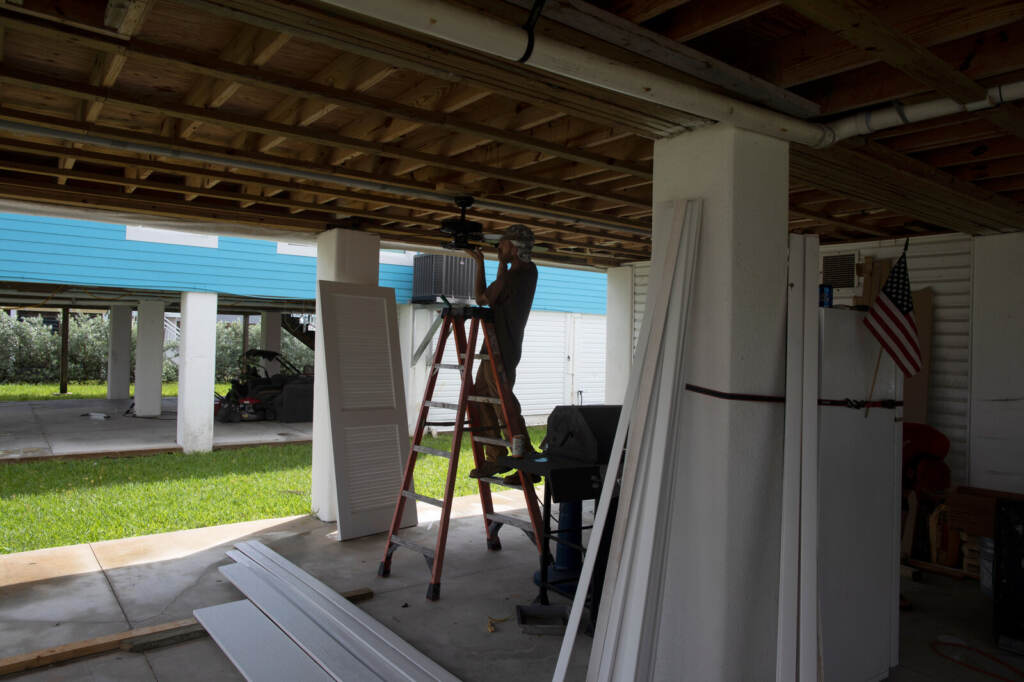 A construction worker does work on Amy's home