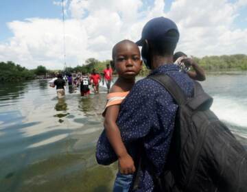 Haitian migrants use a dam to cross into and from the U.S. from Mexico, Saturday, September 18, 2021. (AP Photo/Eric Gay) 