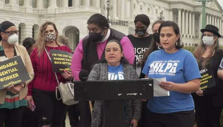 Marcela Ramirez speaks at a podium at a Build Back Better rally