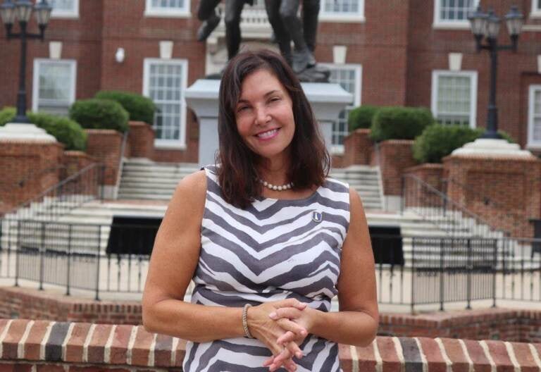 Delaware auditor Kathy McGuiness stands in front of a Delaware government building