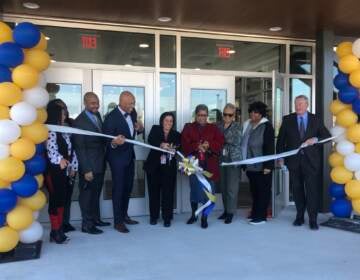 Superintendent William Hite, Mayor Jim Kenney, Solis-Cohen principal Michelina Serianni, and school district officials celebrate the new building with a ribbon cutting ceremony. (Emily Rizzo WHYY)