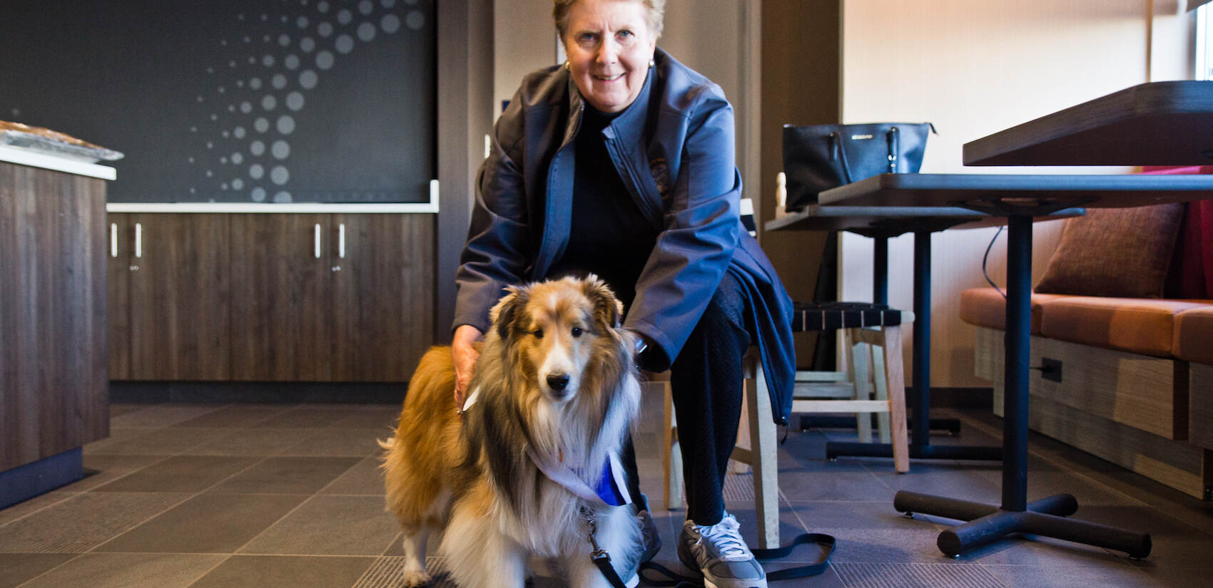  Alice Hoersch and Dyson, a retired AKC champion turned therapy dog, were on hand at the preview of the 2021 National Dog Show represent the NDS Therapy Dog Ambassador Team. (Kimberly Paynter/WHYY)