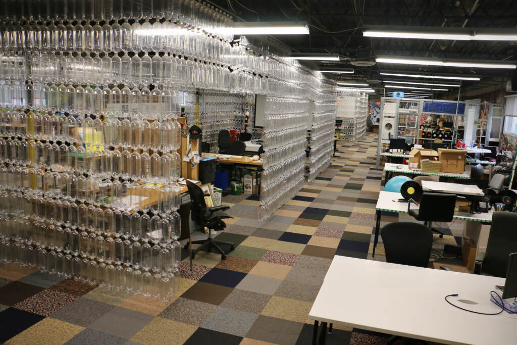 Office partitions formed of recycled plastic bottles are pictured inside TerraCycle's headquarters
