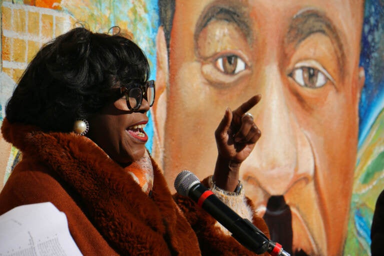 Cherelle Parker speaking in front of a George Floyd mural.