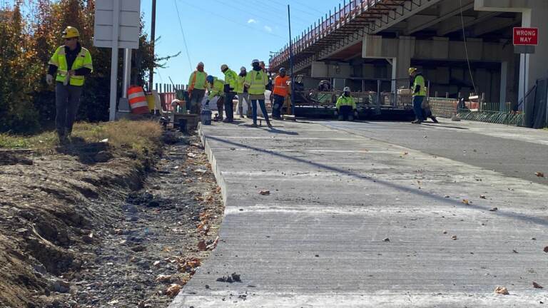 Construction workers rebuild an I-95 off ramp on the city of Wilmington as part of the massive 'Restore the Corridor' interstate project through the city. (Mark Eichmann/WHYY)