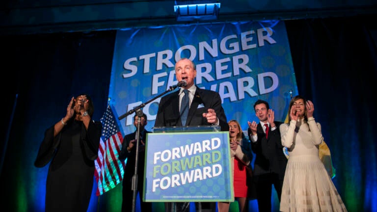 New Jersey Gov. Phil Murphy speaks to supporters from a podium