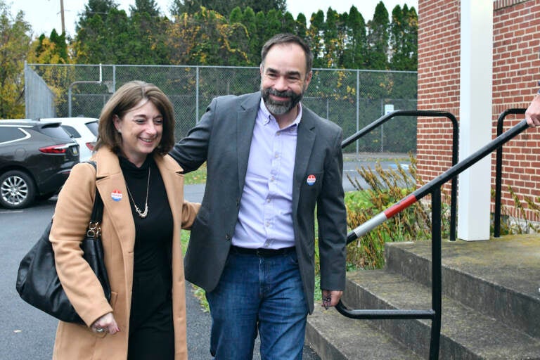 Kevin Brobson walks with his wife, Lauren