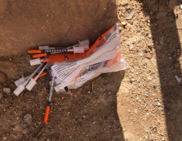 A package of unused syringes and needles is found next to a vacant building in northeast Albuquerque, New Mexico, where crews attempted to clear the lot of used needles and other heroin paraphernalia on Friday, Aug. 9, 2019. Bernalillo County officials have launched a digital mapping tool to track the places where heroin needles and syringes are found in New Mexico's largest city