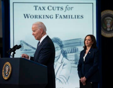 Vice President Kamala Harris listens as President Joe Biden speaks during an event to mark the start of monthly Child Tax Credit relief payments, in the South Court Auditorium on the White House complex, Thursday, July 15, 2021, in Washington. (AP Photo/Evan Vucci)