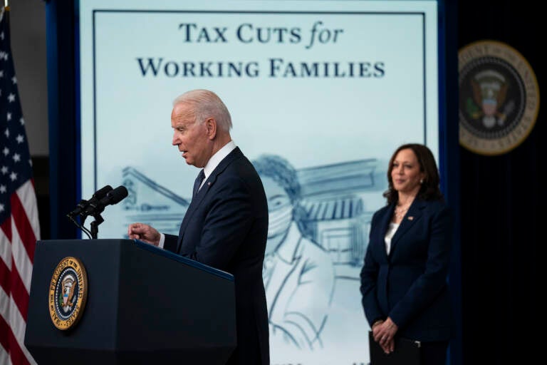 Vice President Kamala Harris listens as President Joe Biden speaks during an event to mark the start of monthly Child Tax Credit relief payments, in the South Court Auditorium on the White House complex, Thursday, July 15, 2021, in Washington. (AP Photo/Evan Vucci)