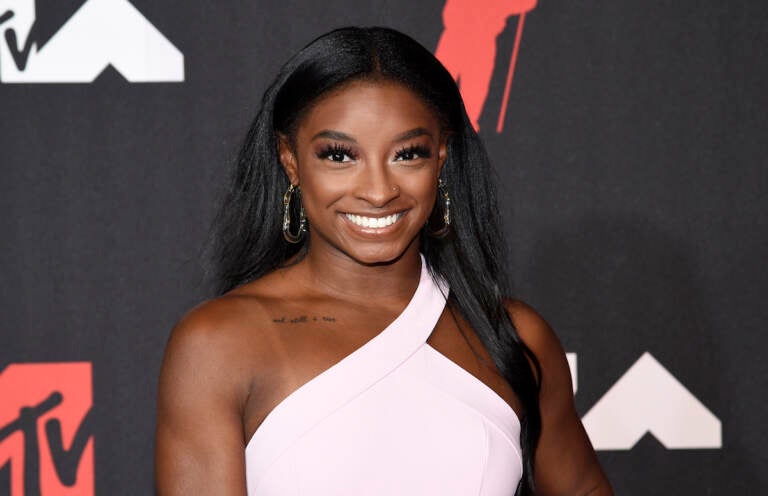 Simone Biles smiles on the red carpet