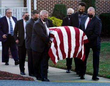 The flag-draped casket of former Delaware Gov. Ruth Ann Minner is carried out of the Church of Nazarene after a funeral service in Milford, Del., Wednesday, Nov. 10, 2021. (AP Photo/Andrew Harnik)