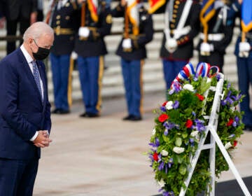 President Joe Biden stands during a wreath laying ceremony to commemorate Veterans Day and mark the centennial anniversary of the Tomb of the Unknown Soldier at Arlington National Cemetery, Thursday, Nov. 11, 2021, in Arlington, Va. (AP Photo/Evan Vucci)